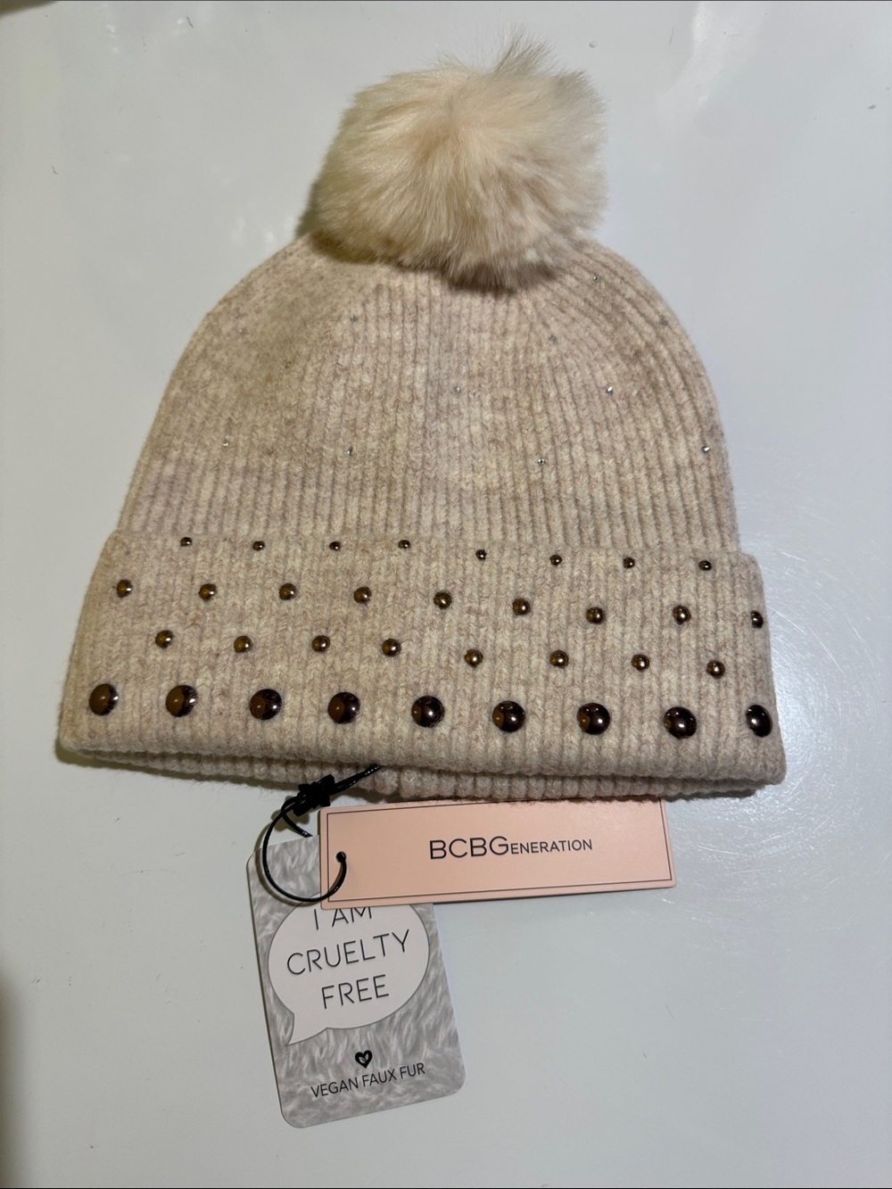 BCBGeneration Beige Knit Beanie with Faux Fur Pom and Stud Accents
